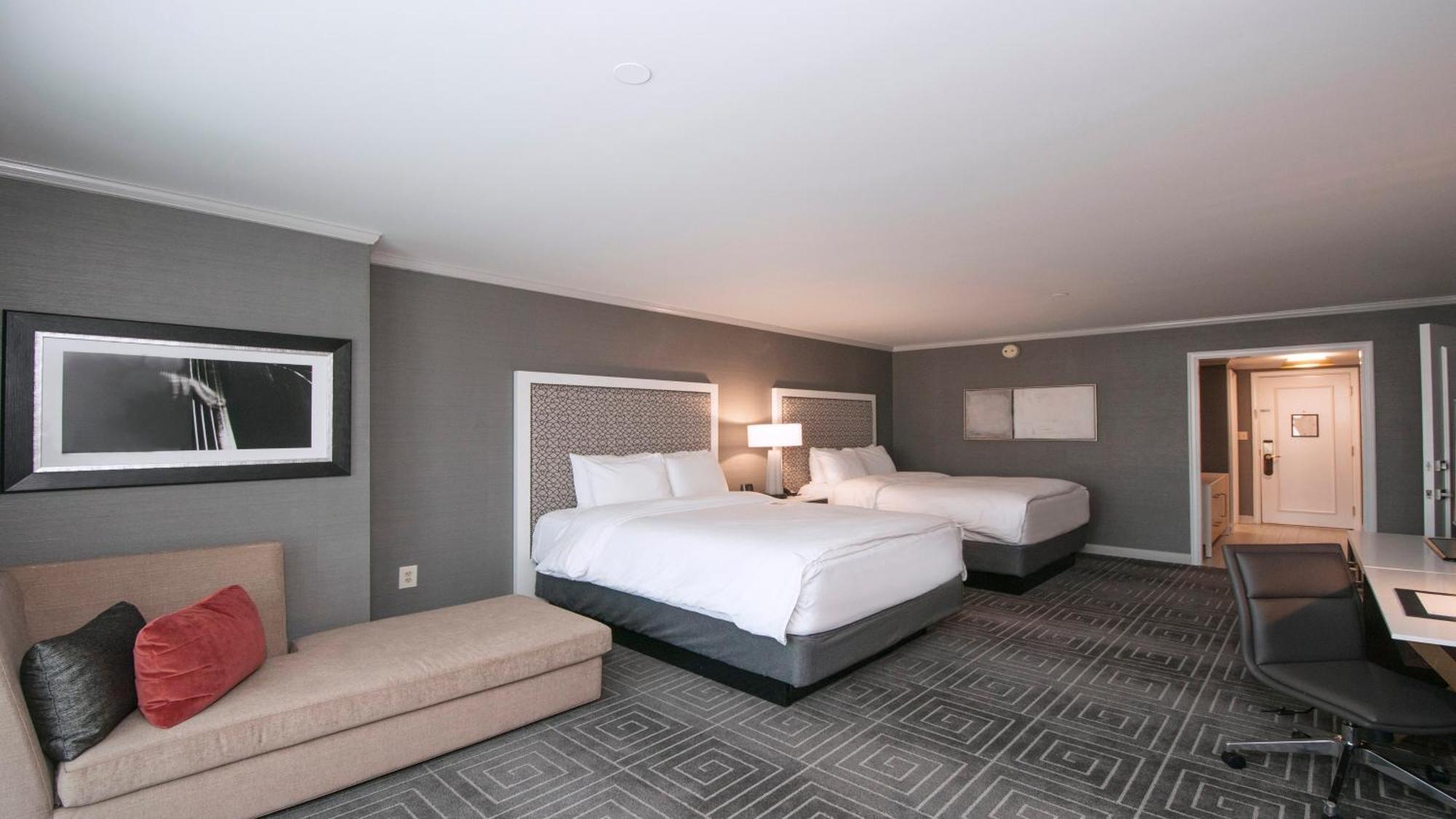 Premium Queen Room with Two Queen Beds and Sofa Bed - Balcony/Plaza View